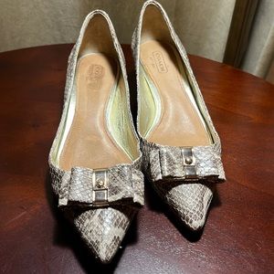Used kitten heel Coach snake print size 7 .